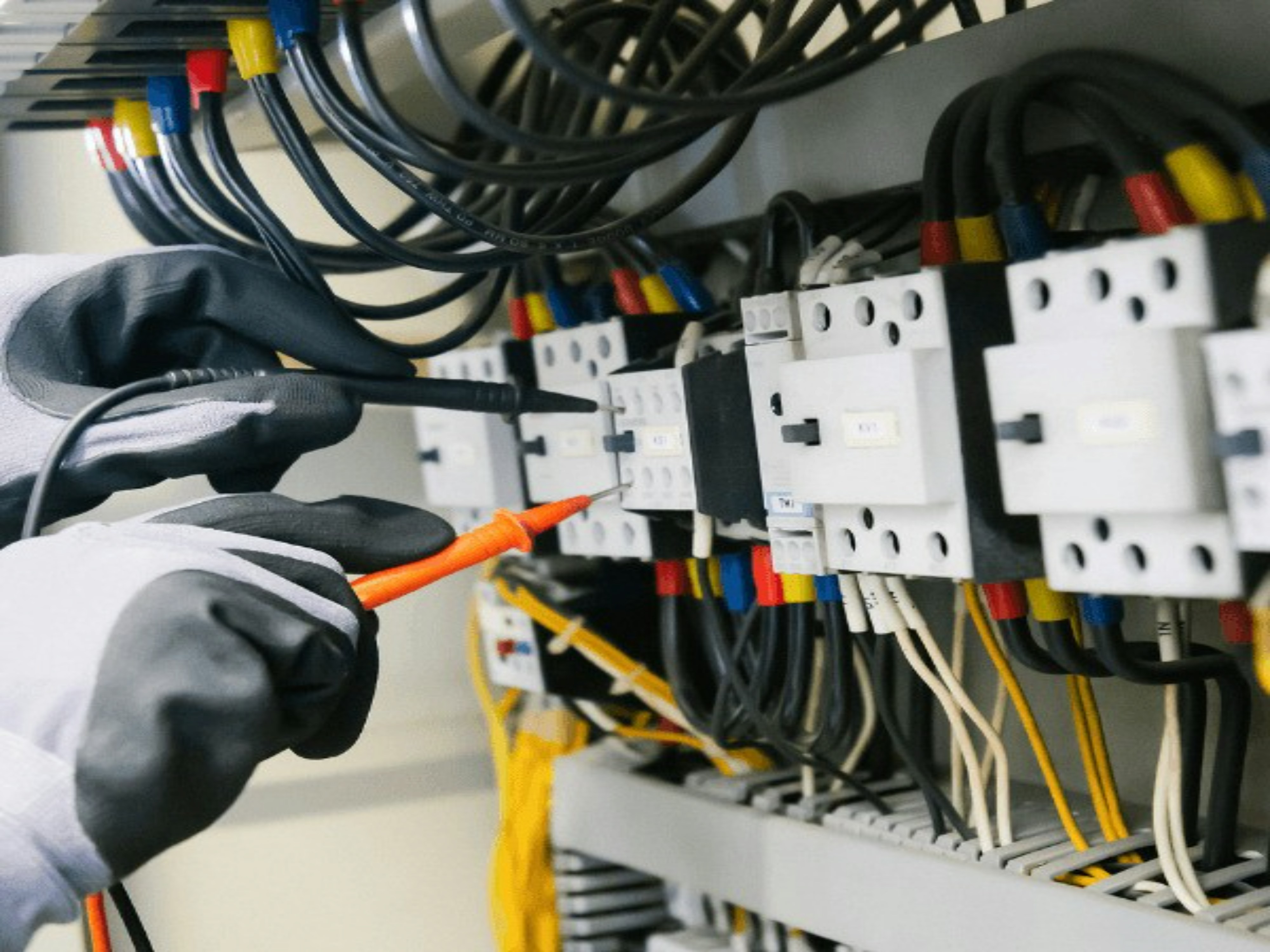 An electrician testing wires